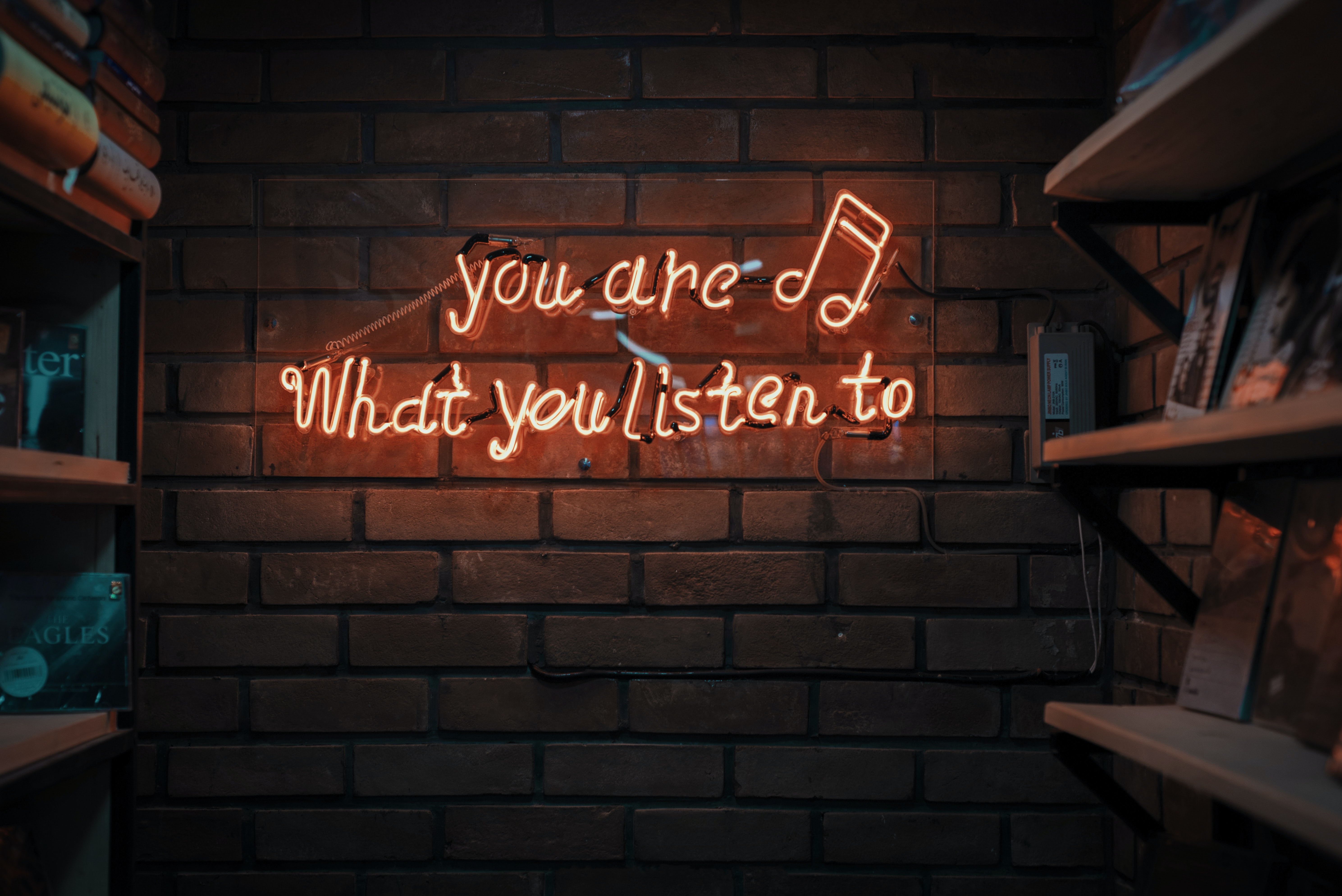 a logo writing you are what you listen to