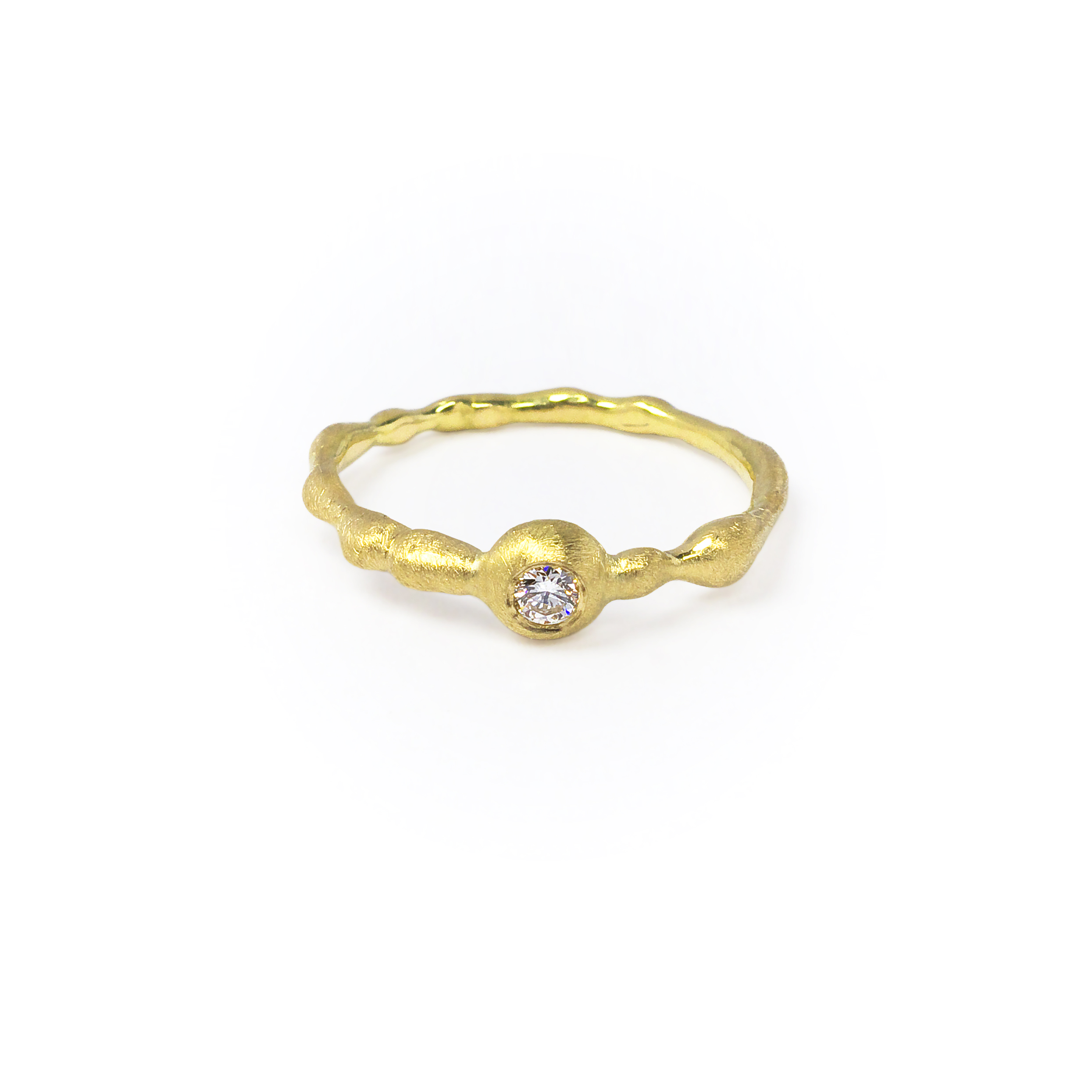 yellow golden organically shaped ring with a big diamond