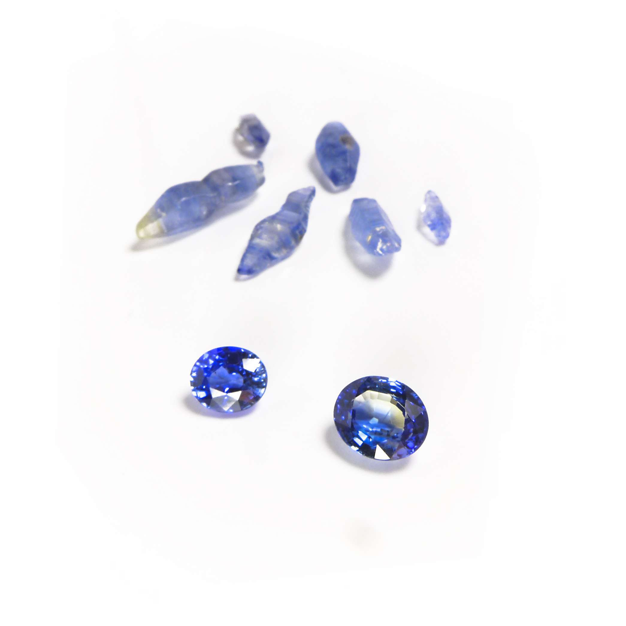 cut and rough blue sapphire stones